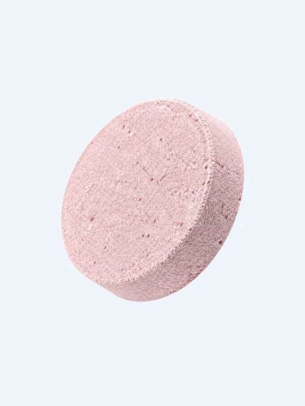 A pink VitalFactors effervescent tablet